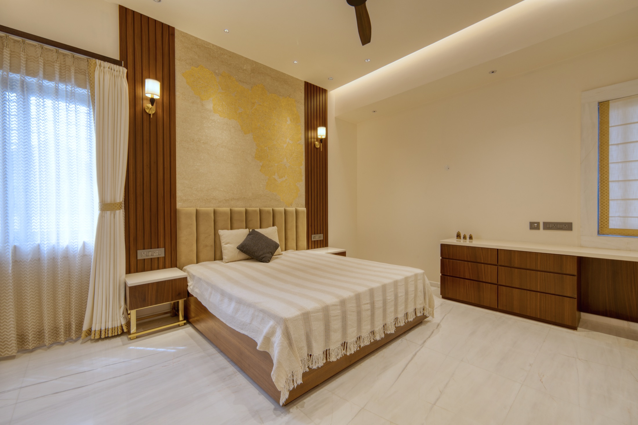 Modi Villa bedroom with custom gold accent wall
