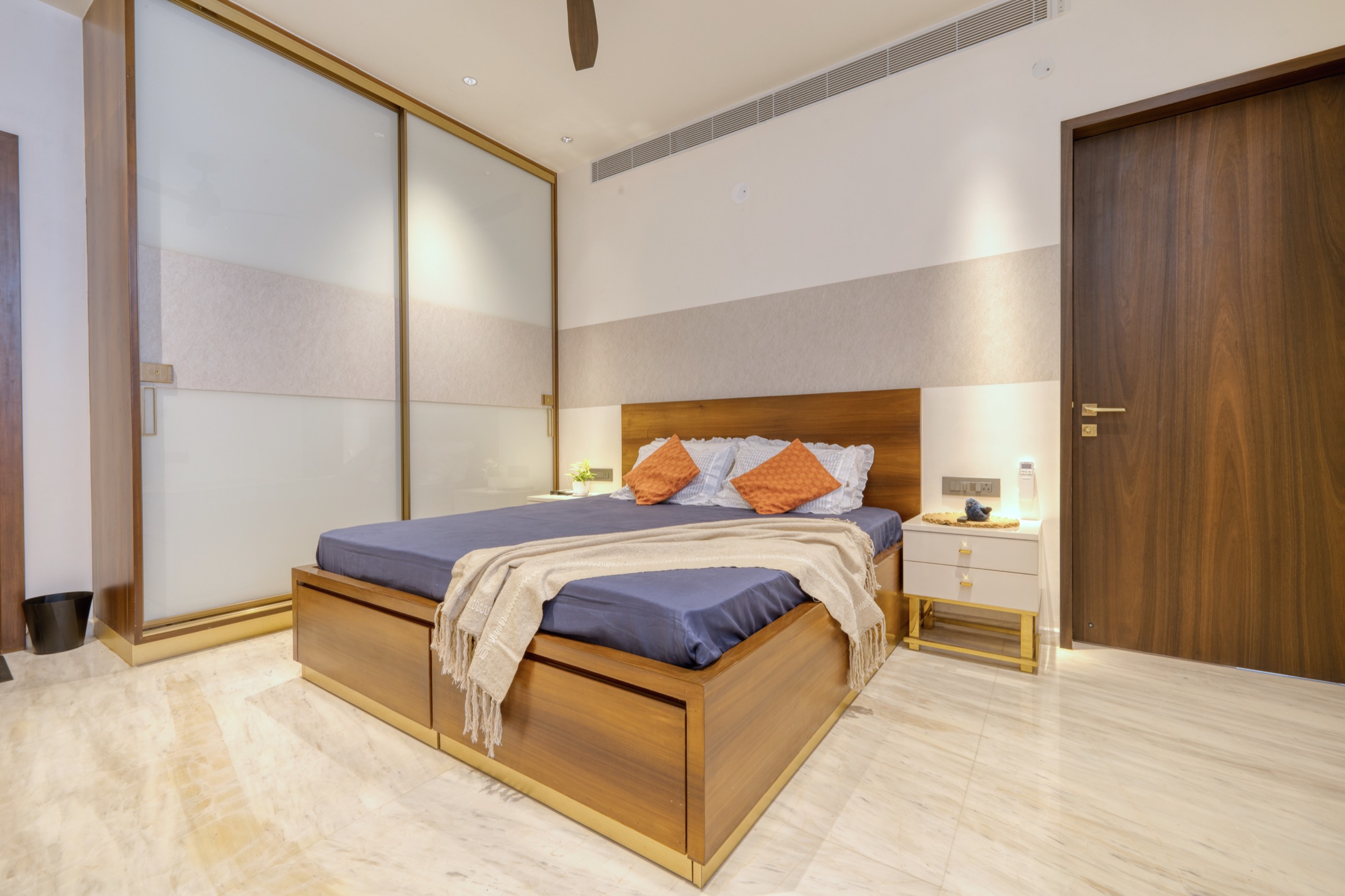 Modi Villa bedroom with custom oak headboard